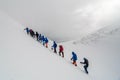 Caucasus / Russia - 07.15.2018 Group of climbers climbing mountain peaks.