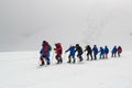 Caucasus / Russia - 07.15.2018 Group of climbers climbing mountain peaks.