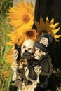 Caught in the act.. selfie style skeletons, with a glow of yellow wild flowers