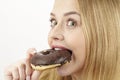 Caught - she eats a donut Royalty Free Stock Photo