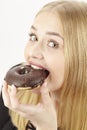 Caught - she eats a donut Royalty Free Stock Photo