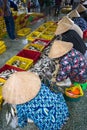 Caught fishes sorting to baskets by Vietnamese women workers in Tac Cau fishing port, Me Kong delta province of Kien Giang, south Royalty Free Stock Photo