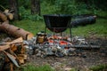 A cauldron for cooking is on the fire Royalty Free Stock Photo