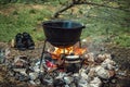 A cauldron for cooking is on the fire Royalty Free Stock Photo