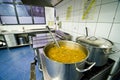 Cauldron of soup in a hotel kitchen Royalty Free Stock Photo