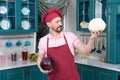 Cauliflower better red cabbage and chef agreed. Man shows big Cauliflower before steam cooking. Man holds vegetables in hands.