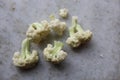 Cauliflower pieces closeup in white background.