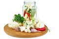 Cauliflower pieces prepared to be canned in glass jar isolated on white background