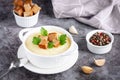 Cauliflower potato soup puree on stone background, Creamy cauliflower soup with toasted bread croutons Royalty Free Stock Photo