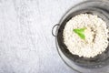 Cauliflower rice in metal bowl on grey background. Top view. Overhead. Copy space. Shredded Royalty Free Stock Photo