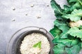 Cauliflower rice in metal bowl on grey background. Top view. Overhead. Copy space. Shredded Royalty Free Stock Photo