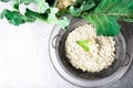 Cauliflower rice in metal bowl on grey background. Top view. Overhead. Copy space. Shredded Royalty Free Stock Photo