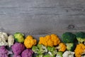 Cauliflower and romanesco broccoli on wooden background. Healthy food concept Royalty Free Stock Photo