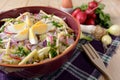 Cauliflower salad with potatoes, hard cheese, eggs, red onion and radish Royalty Free Stock Photo