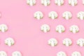 Cauliflower seamless pattern on a pink pastel background.