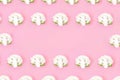 Cauliflower seamless pattern on a pink pastel background.