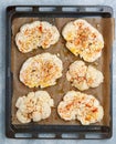 Cauliflower. Sliced raw steaks are ready for baking