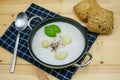 Cauliflower soup in a pot with bread rolls and napkin Royalty Free Stock Photo