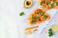 Cauliflower steaks, above view scene over marble with copy space, healthy plant based meat substitute concept