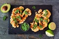 Cauliflower steaks above view on a slate platter, healthy plant based meat substitute concept