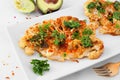 Cauliflower steaks close up on a white marble background, healthy plant based meat substitute concept