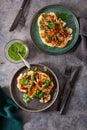 cauliflower steaks with herb sauce and spice. plant based meat substitute