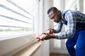 Caulk Sealant Application. Silicone Window Seal Royalty Free Stock Photo