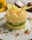 Causa Lima is a traditional starter of Peruvian cuisine made with potato, avocado, chicken or tuna.