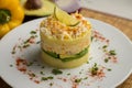 Causa Lima is a traditional starter of Peruvian cuisine made with potato, avocado, chicken or tuna.