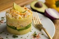 Causa Lima is a traditional starter of Peruvian cuisine made with potato, avocado, chicken or tuna.