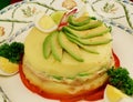 causa limeÃ±a PERUVIAN LAYERED POTATO DISH lemony mashed potatoes layered with chicken sometimes tuna and avocado plate restaurant