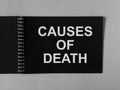 Causes of death on black paper of spiral notebook