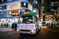 Causeway Bay Hong Kong, busy street cityscape with shoppers, mini bus and cars Royalty Free Stock Photo