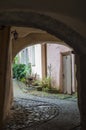 Causeway leading in courtyard through passage Royalty Free Stock Photo