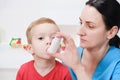 Causian little boy making inhalation with nebulizer at hospital. Royalty Free Stock Photo