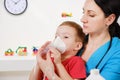 Causian little boy making inhalation with nebulizer at hospital. Royalty Free Stock Photo