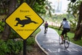 Caution beware water monitor traffic sign and bike lanes