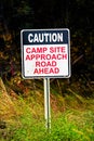 A Caution Camp Site Approach Road Ahead sign Royalty Free Stock Photo