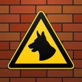 Caution - danger Be aware of dogs The area is guarded by dogs. Warning sign safety. The sign on the brick wall. Vector