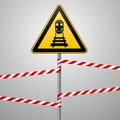 Caution - danger Warning sign safety. Beware of the train. A yellow triangle with a black image. The sign on the pole and protecti Royalty Free Stock Photo