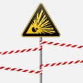 Caution - danger Warning sign safety. Explosive substances. A yellow triangle with a black image. The sign on the pole and protect Royalty Free Stock Photo