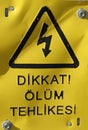 CAUTION DEATH DANGER Sign board with Turkish fonts, Yellow and black sign board Royalty Free Stock Photo