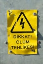 CAUTION DEATH DANGER Sign board with Turkish fonts, Yellow and black sign board Royalty Free Stock Photo