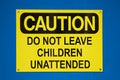 Caution do not leave children sign on a blue background