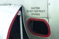 Caution do not obstruct opening decal on an old aircraft Royalty Free Stock Photo