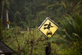 Caution label Old woman witch figurine with car in garden outdoor on forest mountain at pai city hill valley in Mae Hong Son,