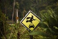 Caution label Old woman witch figurine with car in garden outdoor on forest mountain at pai city hill valley in Mae Hong Son,