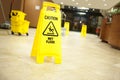 Caution lobby mop bucket and sign Royalty Free Stock Photo