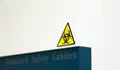 The Caution sign `Biological HazardÃ¢â¬Â for warning inflected biohazard area, a safety sign warning on biosafety cabinet in lab.