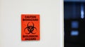 The Caution sign `Biological HazardÃ¢â¬Â for warning inflected biohazard area, a safety sign warning. Royalty Free Stock Photo